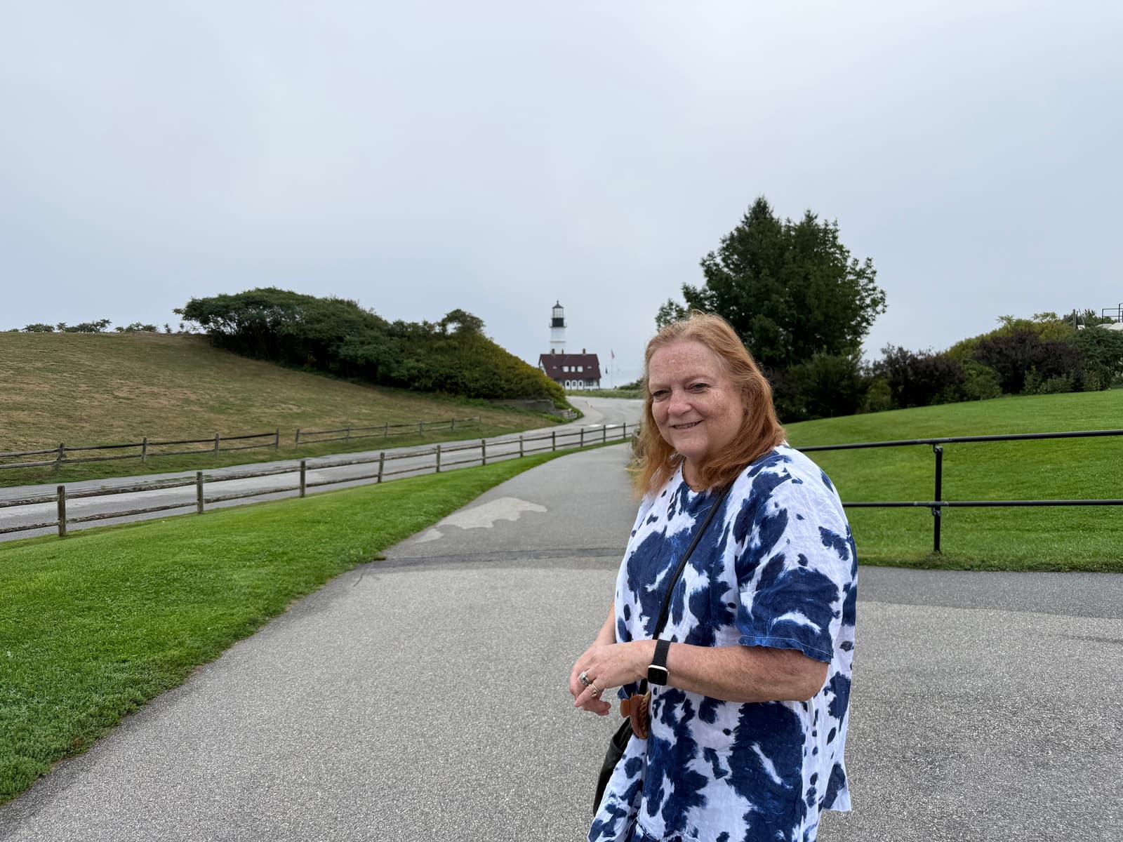 Michele Merin visiting a lighthouse during her travels